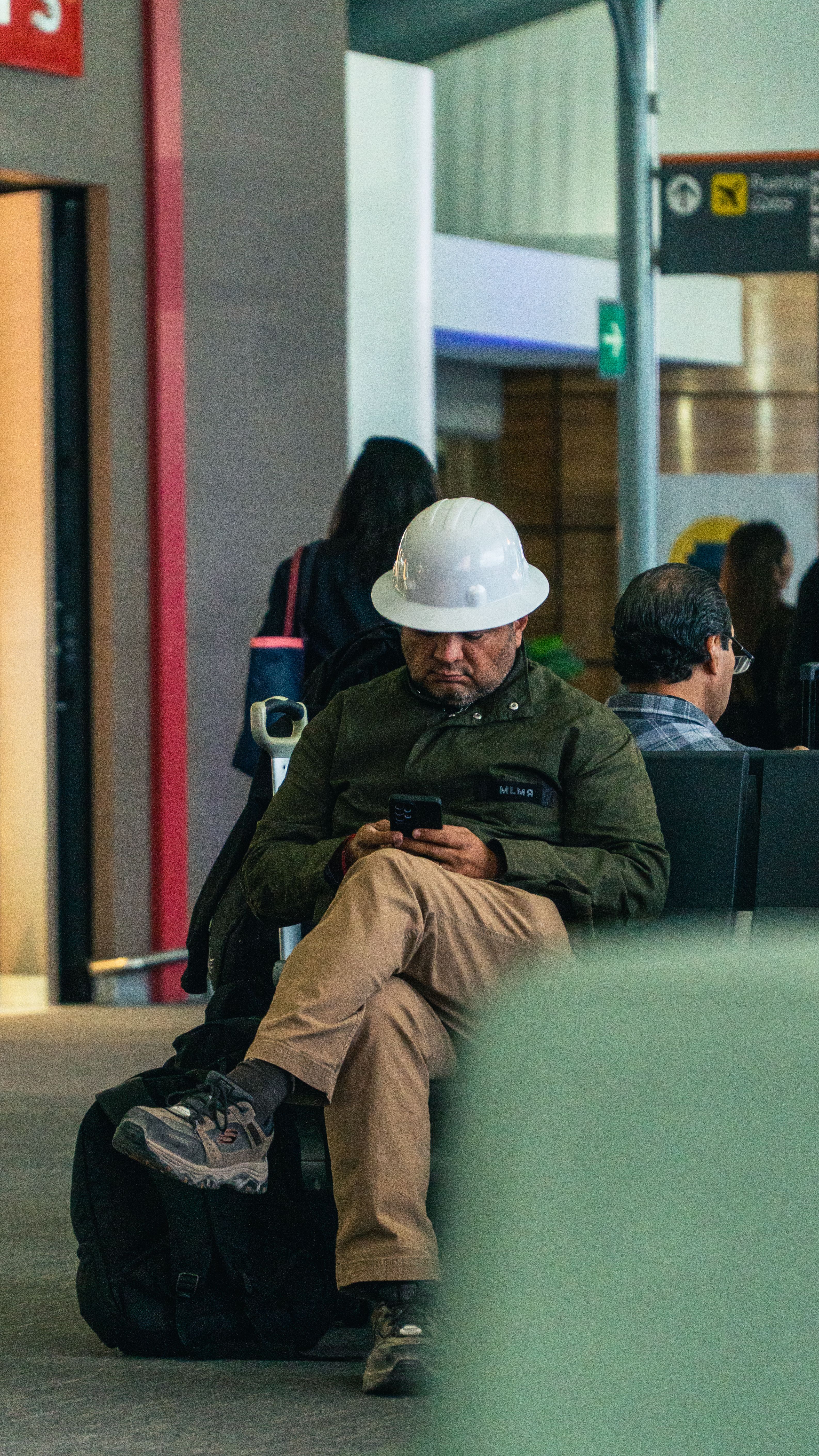 A worker on site looking down at his phone